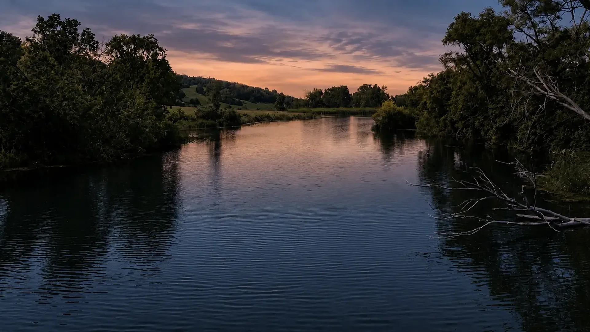 Private lake reflecting the evening sky